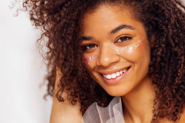 istock Charming african american with perfect skin and sequins on her cheeks 2162159134