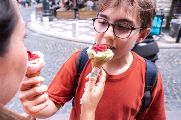 istock Mother and Child Tasting Each Other's Ice Cream 2162162528