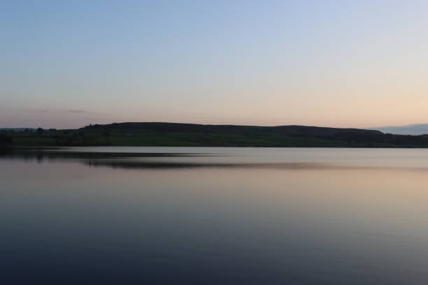 istock Sunset over a calm lake in summer 2162163605
