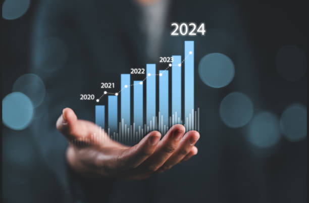 istock Businessman holding glowing virtual technical graph and chart for analysis stock market in 2024, technology investment and value investment concept. 2162166696