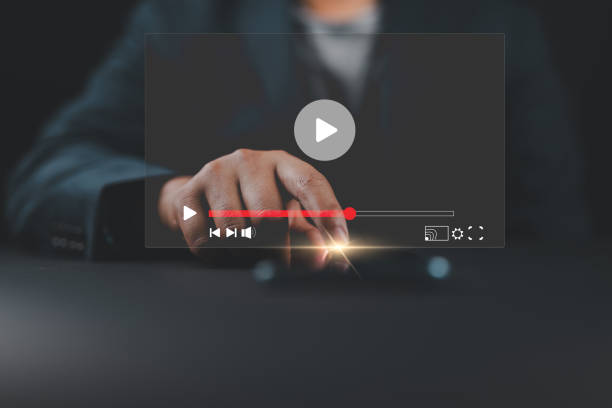 istock Man touching smartphone to watching and live streaming window for Video streaming on internet and multimedia technology concept. 2162166699