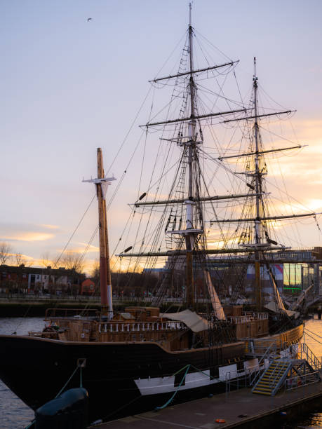 istock Sailing ship at sunset in European town 2162166758