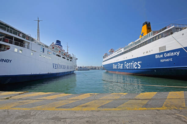 Piraeus, Greece - May 04, 2015: Ventouris Sea Lines and Blue Star Ferries Ships Moored at Port of Piraeus Sunny Spring Day.