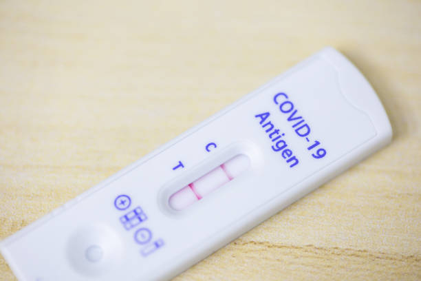 istock Positive test result  on home test kit. Corona or Covid-19 rapid tests for home testing. 2162174375
