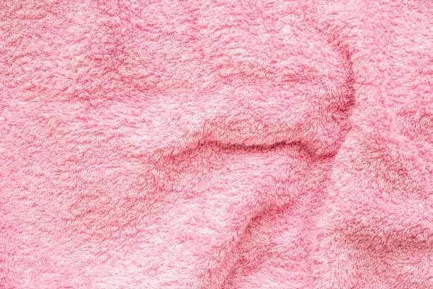 istock Pink fluffy towel fabric soft texture background 2162174574