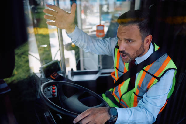 istock Frustrated bus driver yelling at someone while driving. 2162176981
