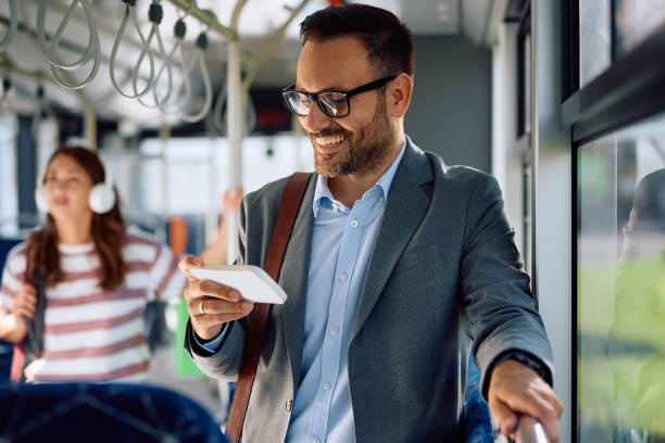 istock Happy entrepreneur using smart phone while riding in a bus. 2162177062