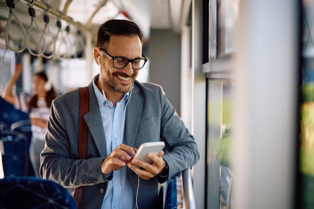 istock Happy entrepreneur using mobile phone in city bus. 2162177081