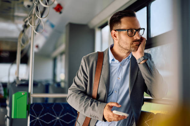 istock Pensive businessman commuting to work by city bus. 2162177098