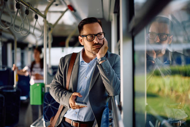 istock Distraught entrepreneur looking through the window while riding in a bus. 2162177107