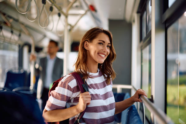 istock Happy woman commuting by public transport. 2162177114