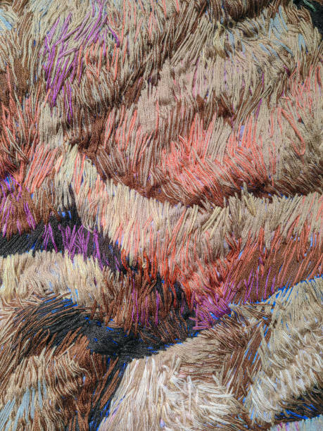 Close up of earth color textile art pattern