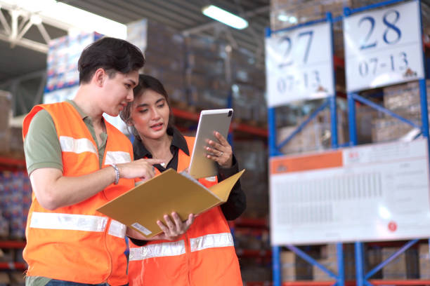 istock Team of warehouse staffs have a morning brief together before going to work. 2162183848