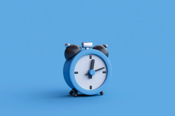 istock 3D rendering of alarm clock on blue background. 2162184212