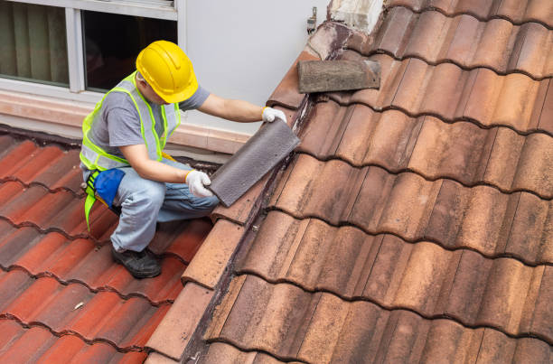 istock Worker fixing eaves and tiles of the old roof. 2162184618