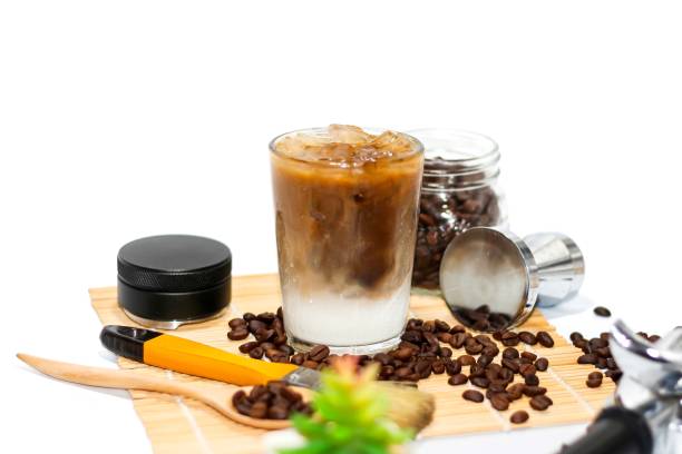 istock Latte ice coffee and coffee beans put on the bamboo mat,isolate concept. 2162187395