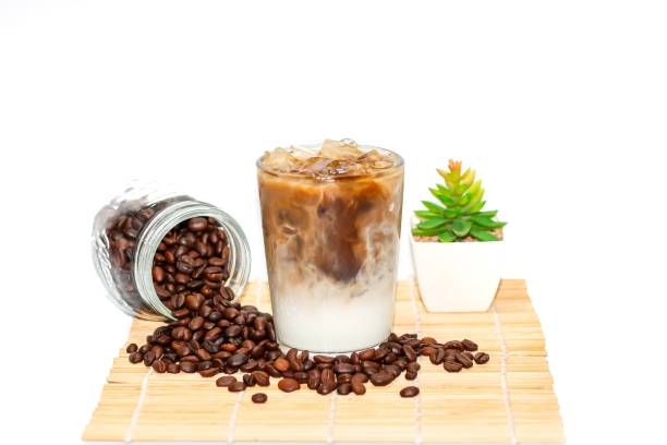 istock Latte ice coffee put on bamboo with isolated concept,coffee beans. 2162187444