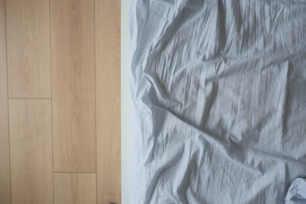 istock messy bed in early morning , messy bed after waking up 2162192890