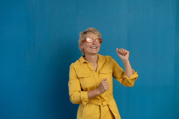 istock A happy woman is dancing 2162193530