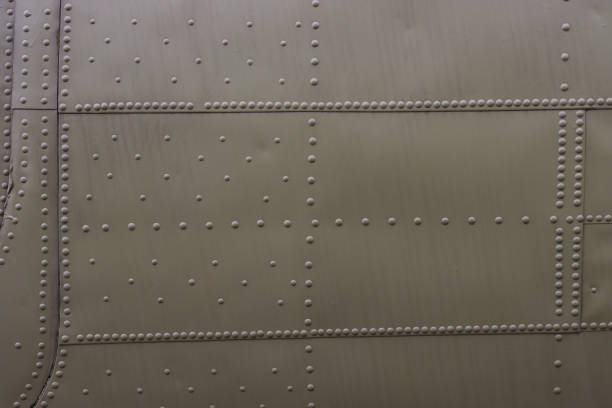 Surface of sheet metal with rivets. Airplane fuselage.