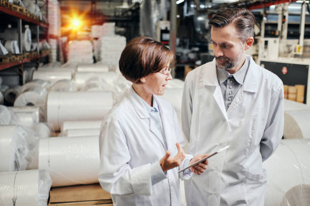 istock Two engineers working at the polymer factory warehouse 2162194683