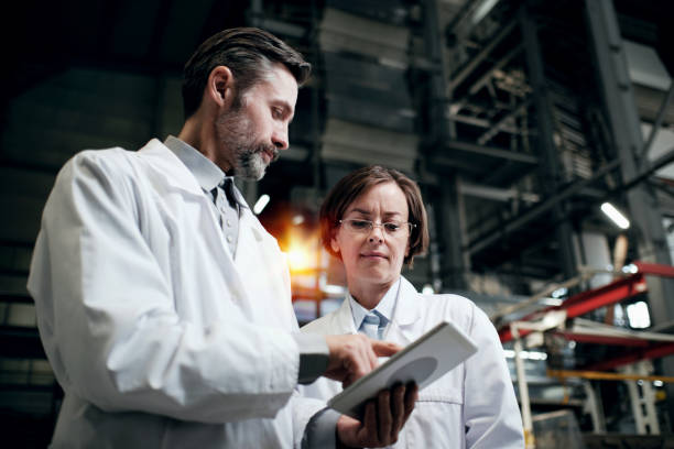 istock Two engineers working at the factory on the tablet 2162194726
