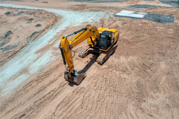 istock aerial view of excavator on the construction site digging 2162195102