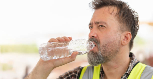 istock Man drinking water at the precast factory site, Engineer man drinking water at construction site 2162196181