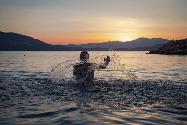 A man enjoys swimming in the sea