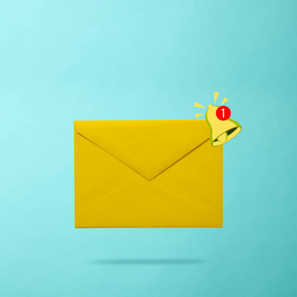 istock Email notice with yellow ringing bell on light blue background 2162199779