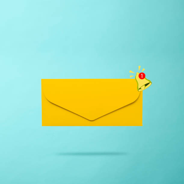 istock Email notice with yellow ringing bell on light blue background 2162199784