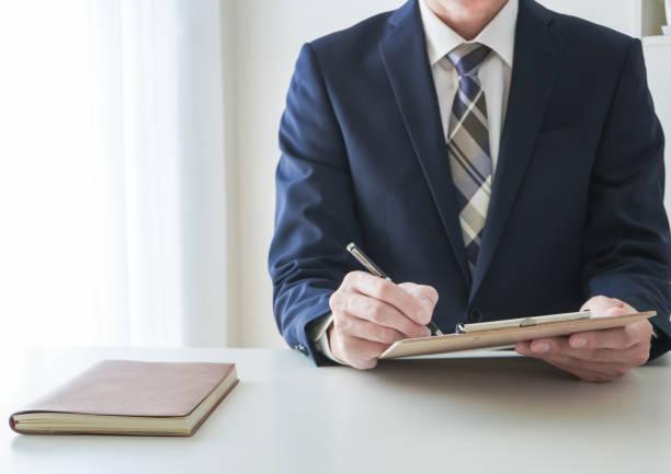 istock Front view of a businessman writing documents 2162200847