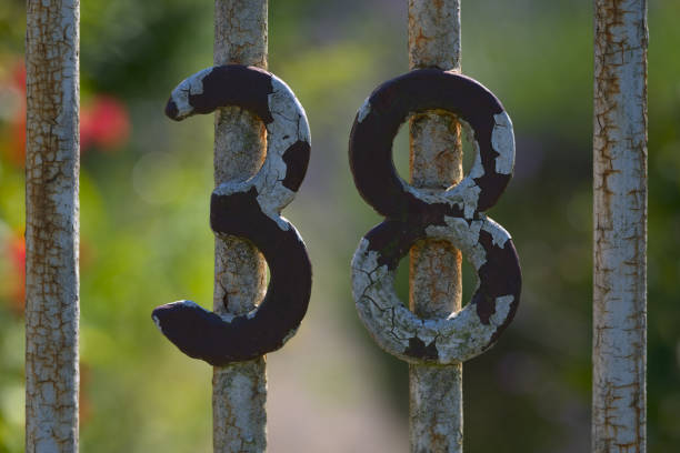 istock Decaying metal number 38 on rusty gate 2162201379