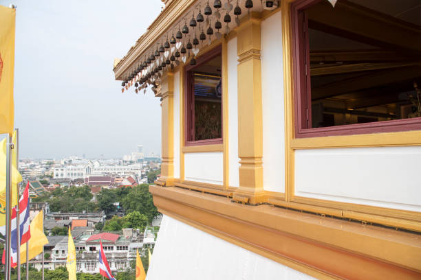 Bangkok, Thailand- 17 Feb, 2023: Golden Mount or Wat Saket during day time. It is an Ayutthaya-era shrine with a gleaming gold chedi in Bangkok