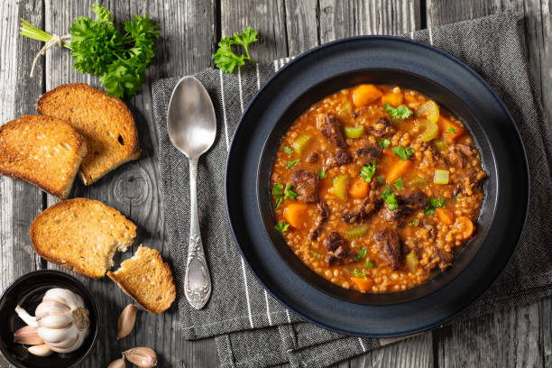 istock beef barley soup in a bowl, top view 2162202086