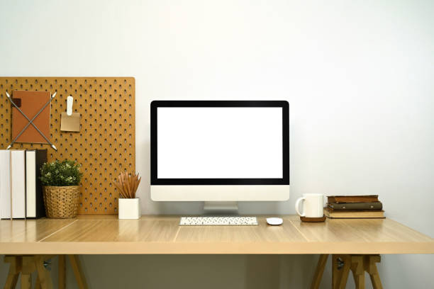 istock Stylish workplace. Modern desktop computer, books and houseplant on white table 2162203374