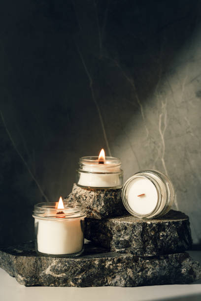 istock Burning Candles On Rustic Stone Slabs close up 2162203498