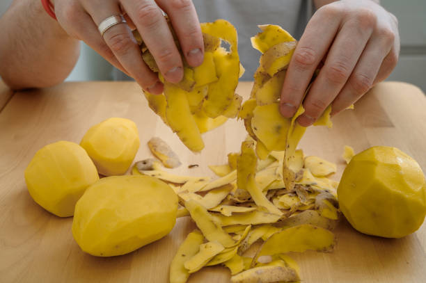 istock Potato peelings held in hands close up 2162206555