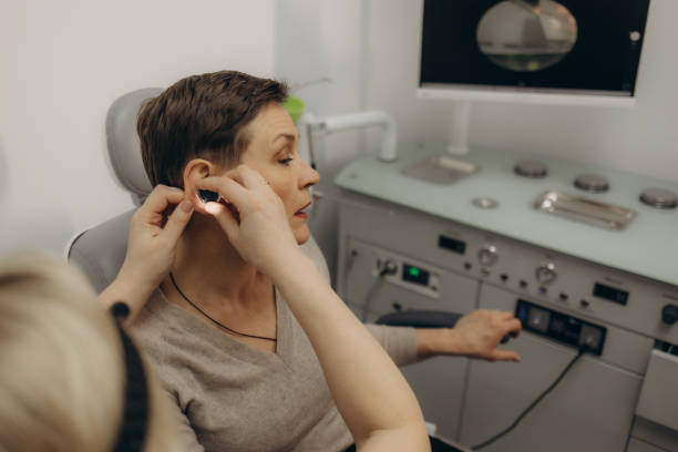 istock ENT doctor examining an elderly female patient 2162209122