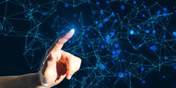 istock A hand interacting with digital geometric shapes on a dark blue background, expressing a concept of connectivity and technology 2162210635