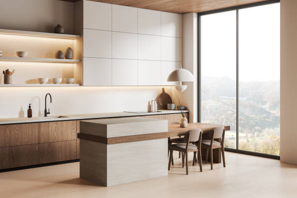 istock Luxury home kitchen interior with bar island and chairs, cabinet and window 2162212110