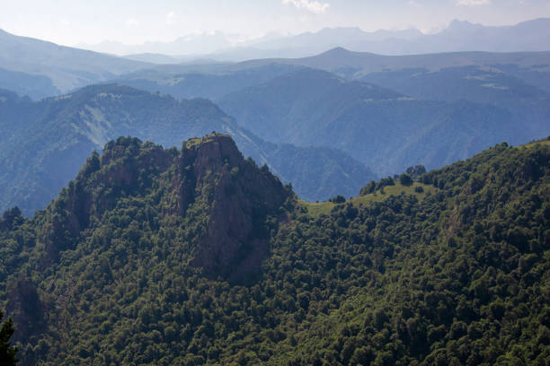 Beautiful multi-faceted mountain landscape in the haze, stretching into the distance on a sunny day