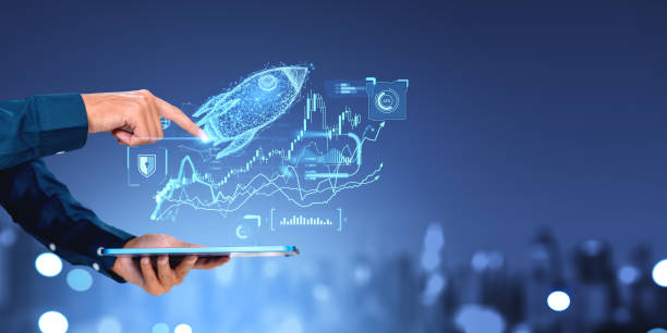 istock Businessman with tablet finger touch rocket, forex statistics and graph chart 2162212565