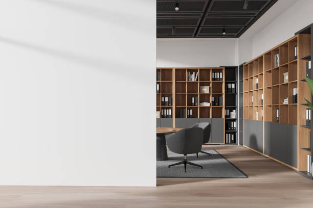 istock White open space office interior with bookcase and blank wall 2162213535