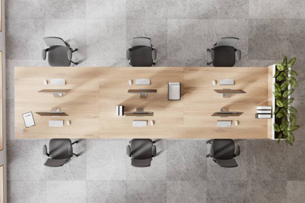 istock Top view of office interior with pc computers on desk with plant 2162214014