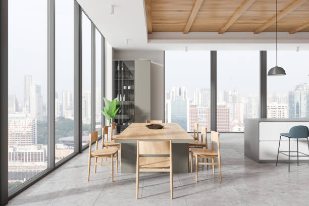 istock Modern home kitchen interior with dining table and chairs, island and window 2162214436