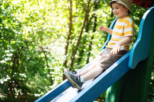 Preschool boy having fun on the playground.