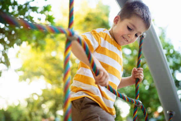 Preschool boy having fun on the playground.