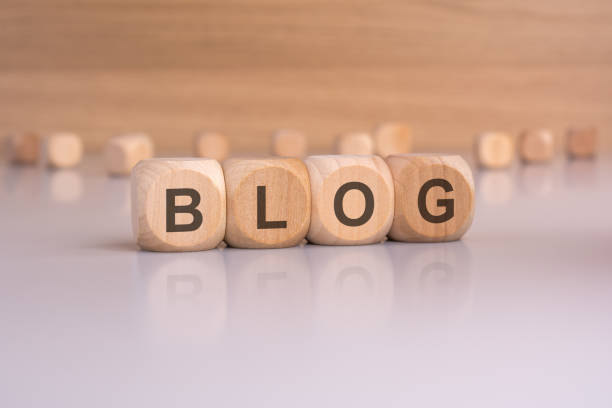 this photo features wooden dice spelling BLOG, perfect for trivia, education, and game related visuals