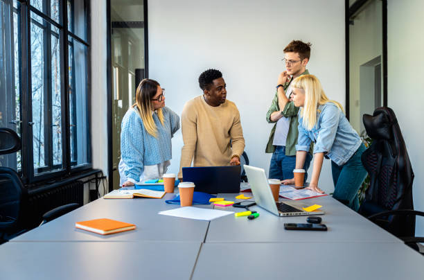 istock Diverse group of young people working on new project together in office. 2162217706